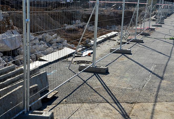 temporary fence panels separating and marking off a work zone